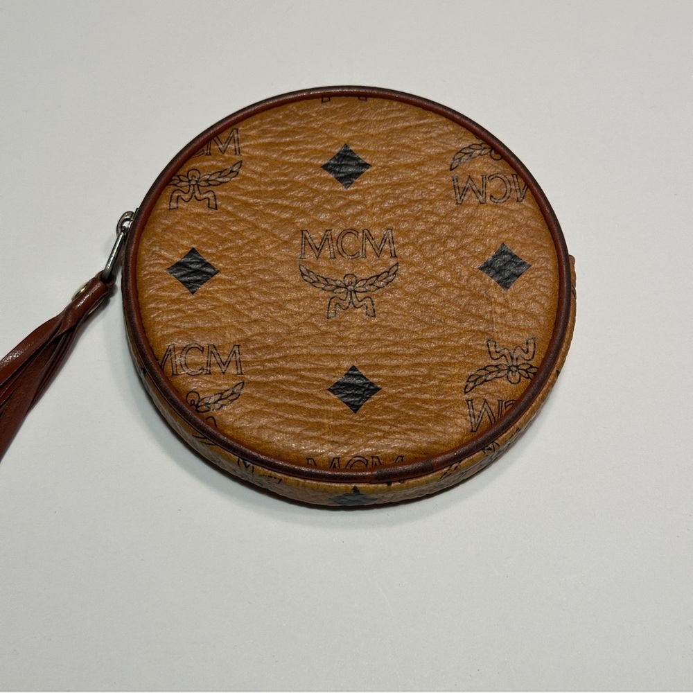 MCM Visetos 4" round coin purse, cognac leather, tassel